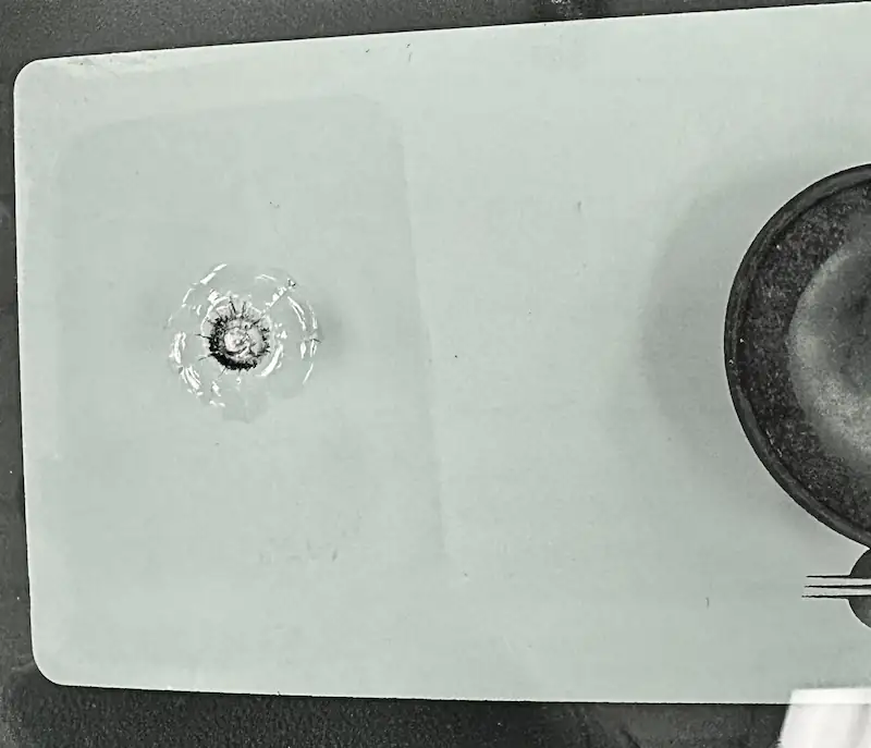 Windshield chip before repair
