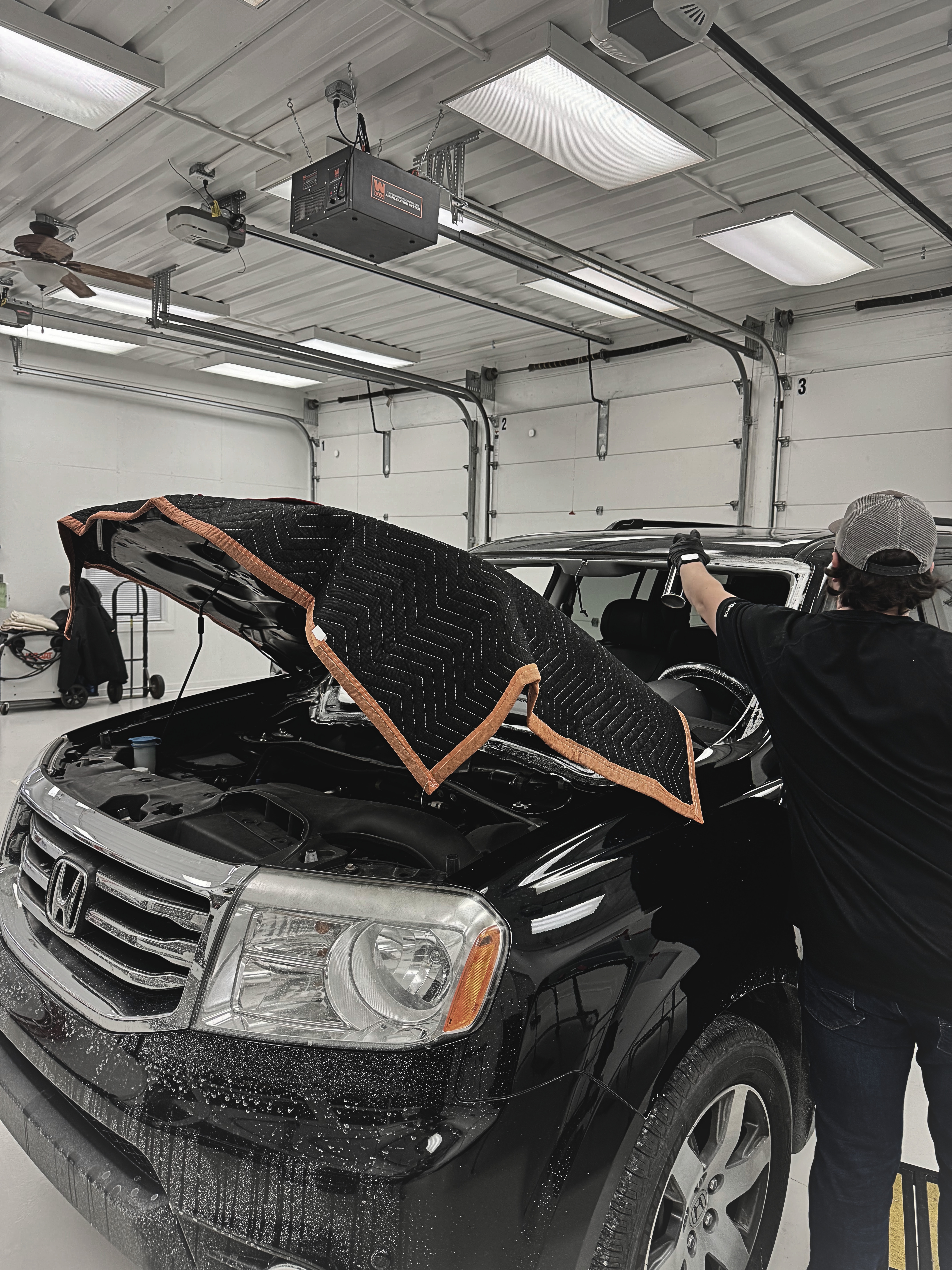 Windshield removal on black Honda Pilot at Ping Precision Auto Glass Columbus Indiana