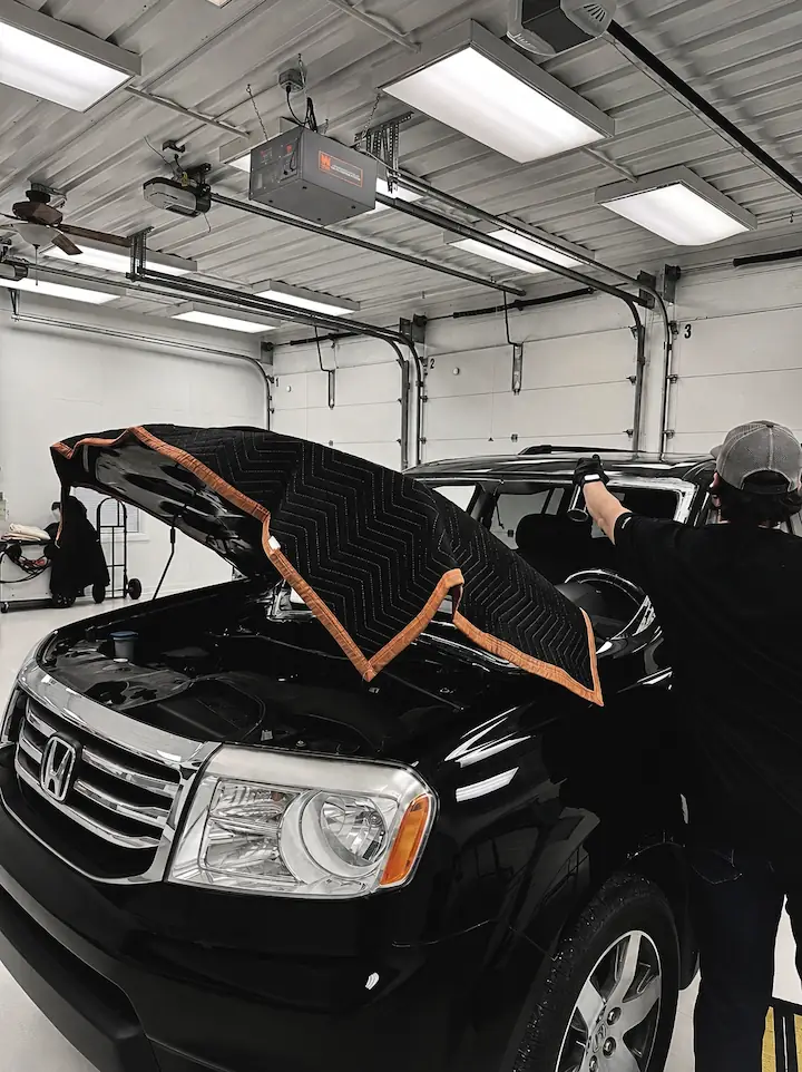 Windshield removal on black Honda Pilot at Ping Precision Auto Glass Columbus Indiana