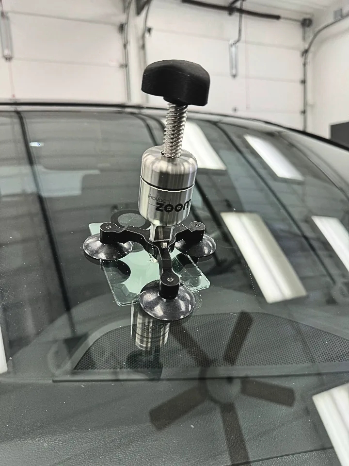 Chip repair injection tool on windshield